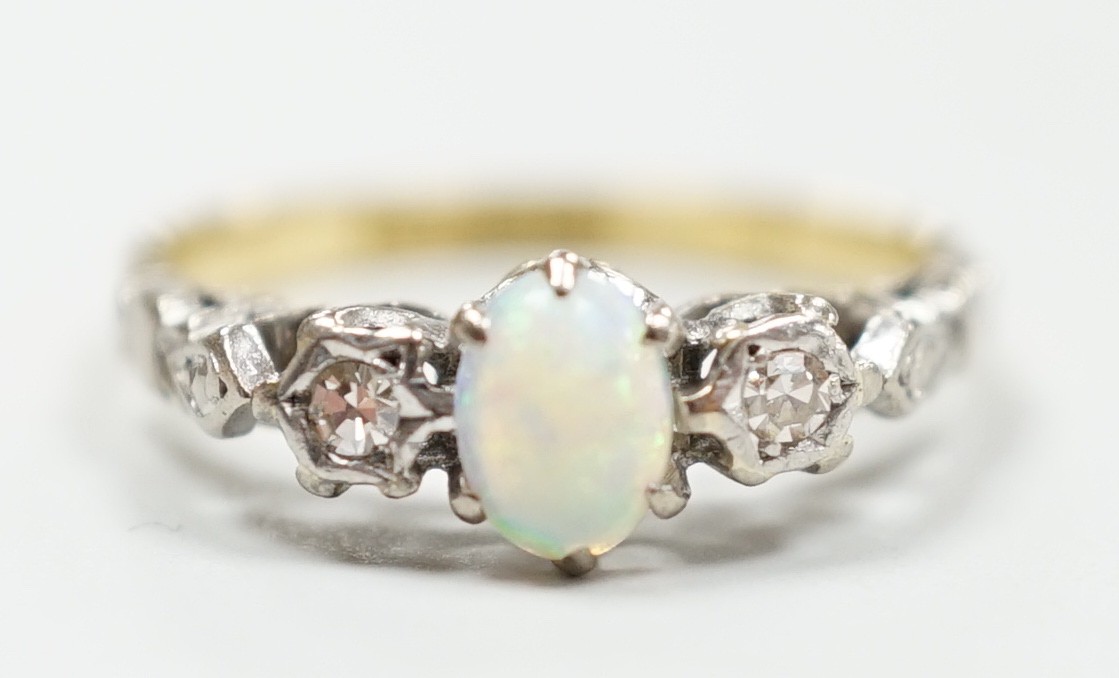 An 18ct and plat, single stone cabochon white opal and two stone diamond set ring, size L/M, gross weight 2.8 grams.